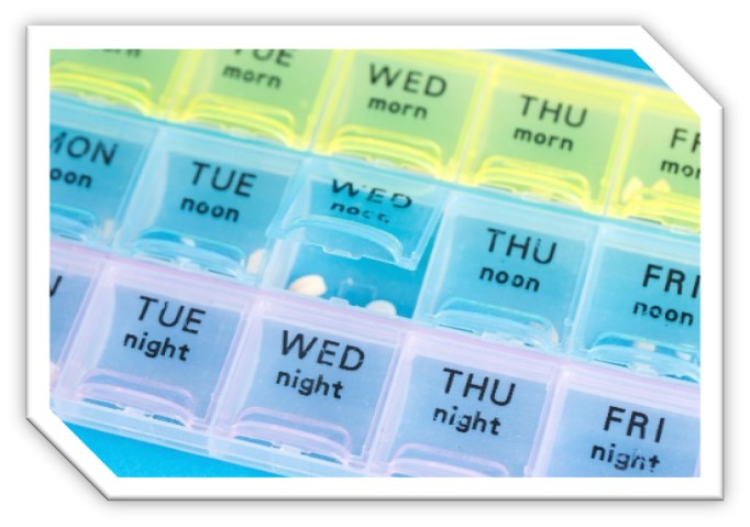 A pill box with the days of the week on each box.