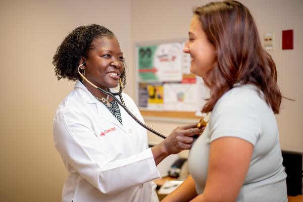 UGA physician assistant Kimberly Brown-Clarke checks a patient during a visit at the University Health Center.