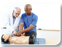 Image of student practicing chest compressions on a mannequin.