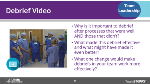 Debrief Video. Image of slide: a group of physicians are having a debrief discussion.