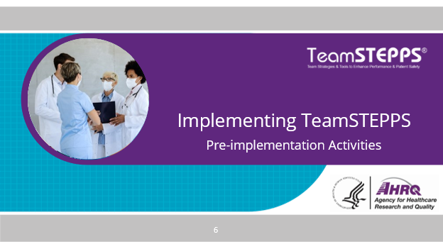 Image of slide:: In this image a team of healthcare providers stand together discussing a patient.